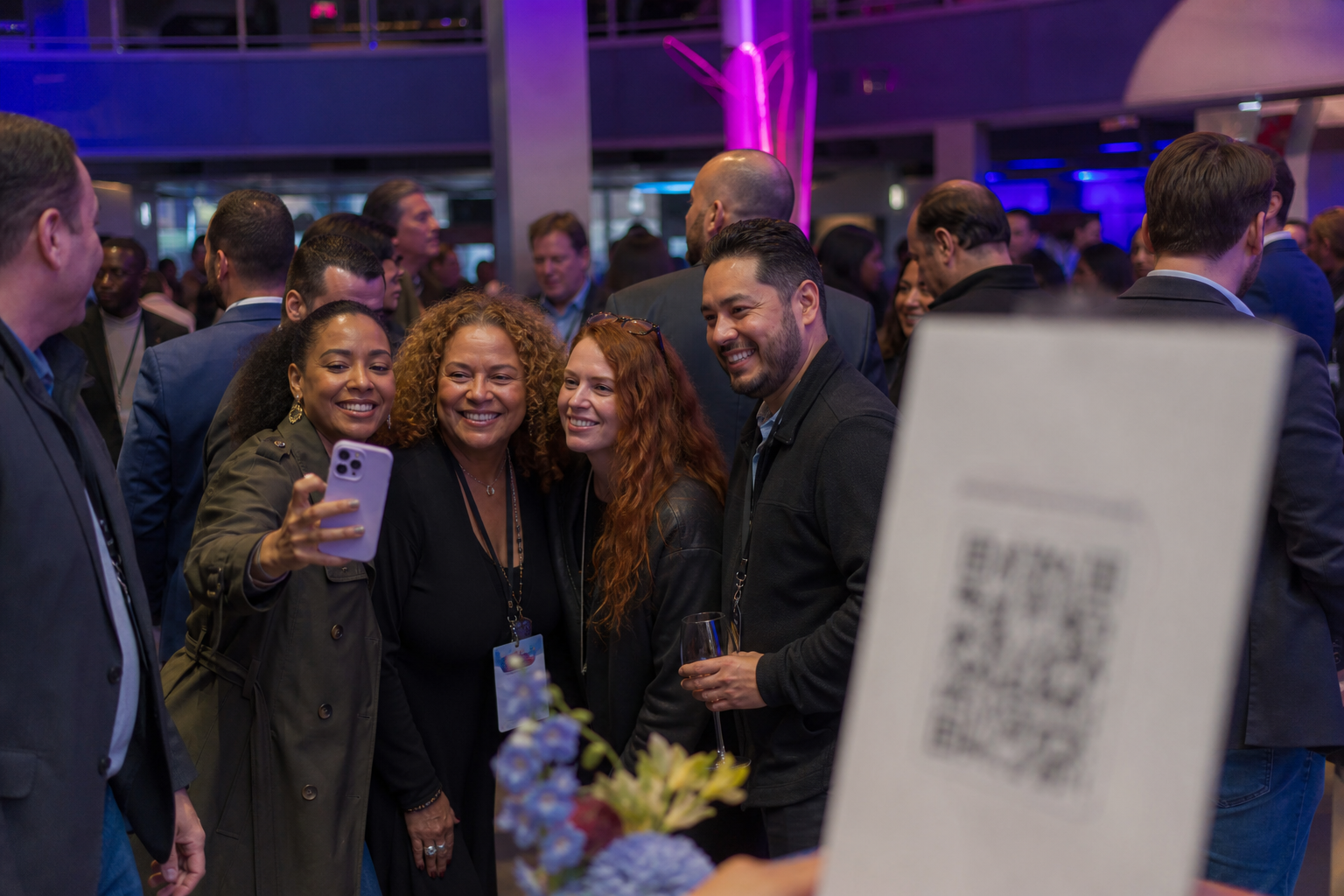 Guests taking photos near a QR code